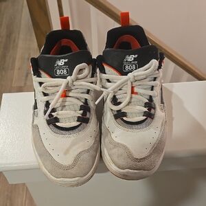 New Balance White and Black Sneakers with Red Accents